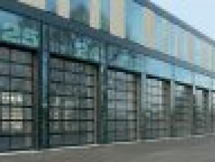 Portes sectionnelles pour transparence et clarté